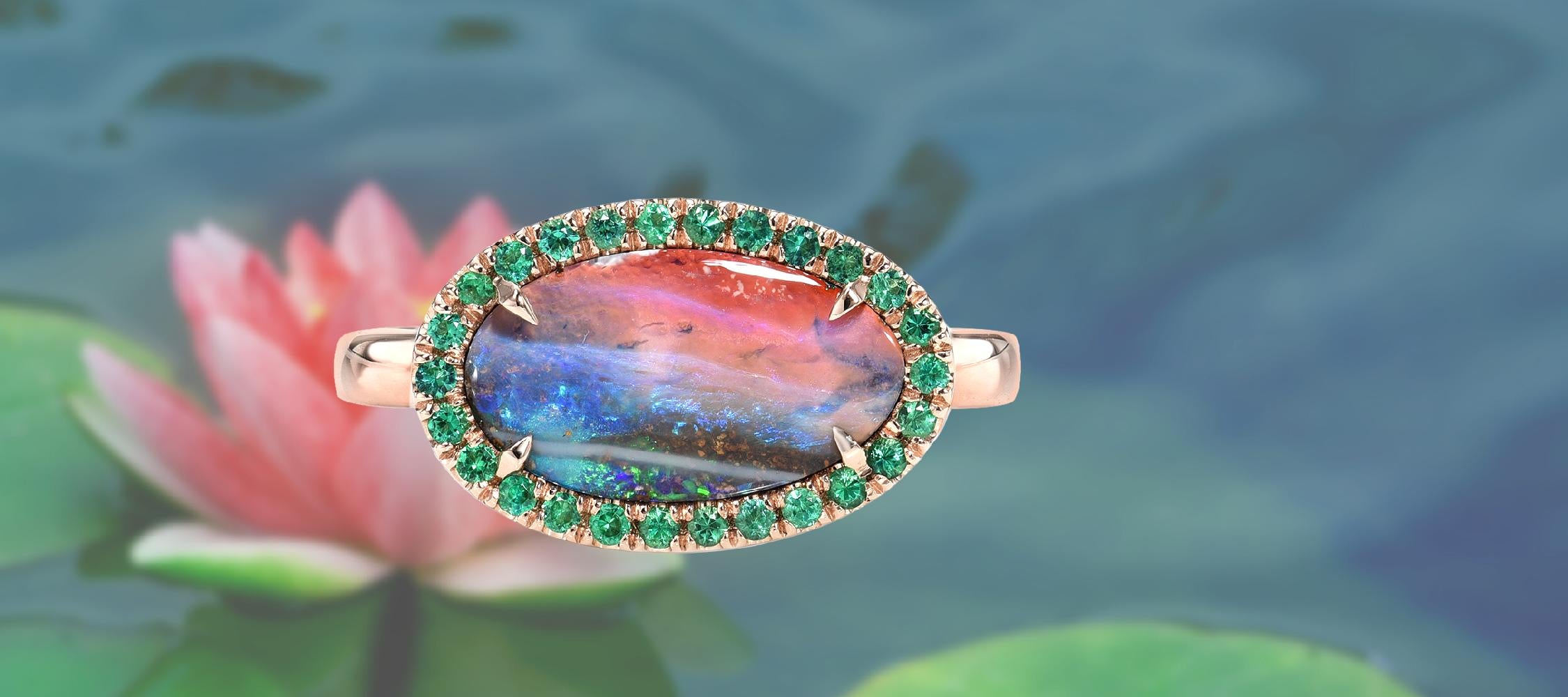 Lotus Australian Opal and Emerald Ring by NIXIN Jewelry against lotus pond backdrop