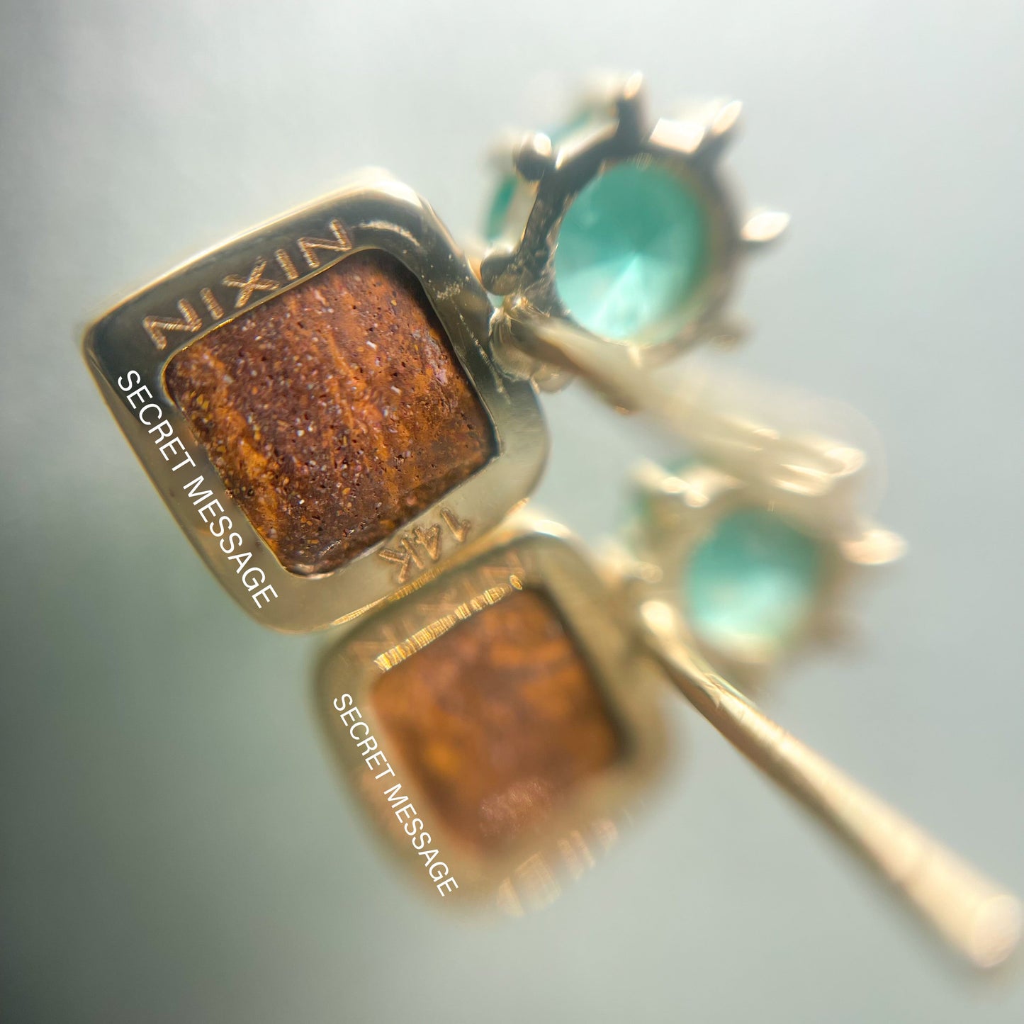 Louped shot of the back of Australian Opal Earrings by NIXIN Jewelry. Shows the location of the secret engraving on the opal earrings.