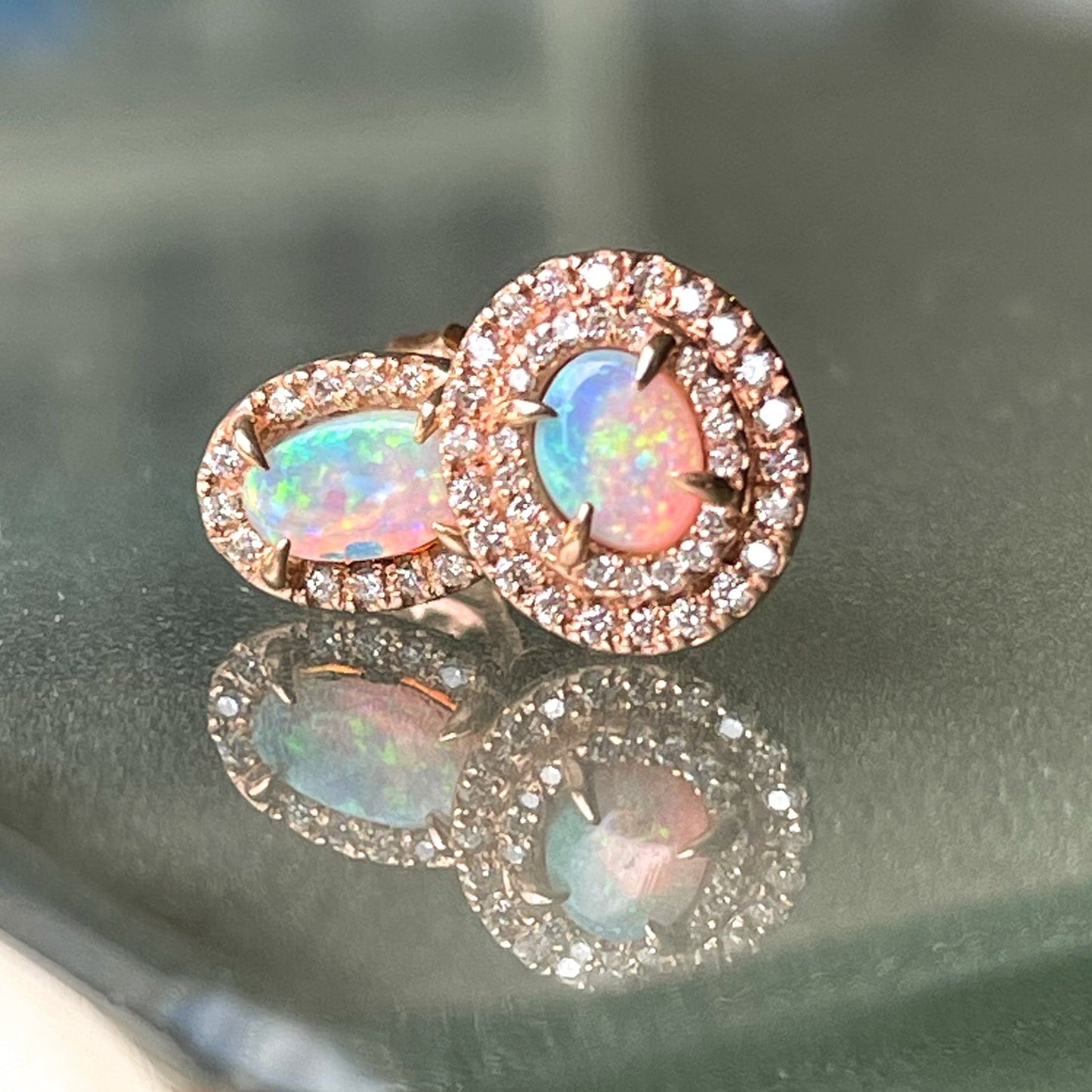 A pair of Australian Opal Earrings by NIXIN Jewelry. Rose gold opal stud earrings.