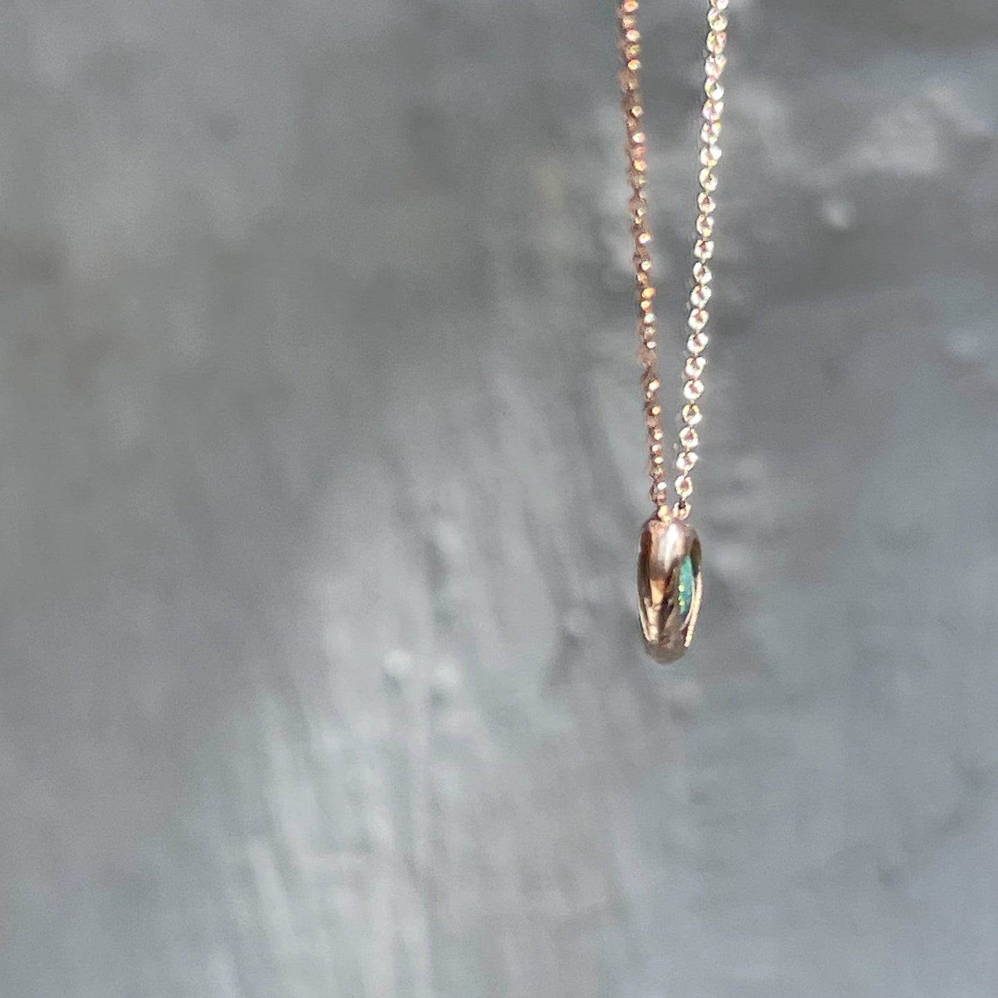 Profile of a rose gold Australian Opal Necklace by NIXIN Jewelry.