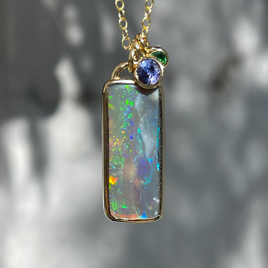 An Australian Opal Necklace by NIXIN Jewelry. The unique opal necklace has a black opal from lightning ridge.