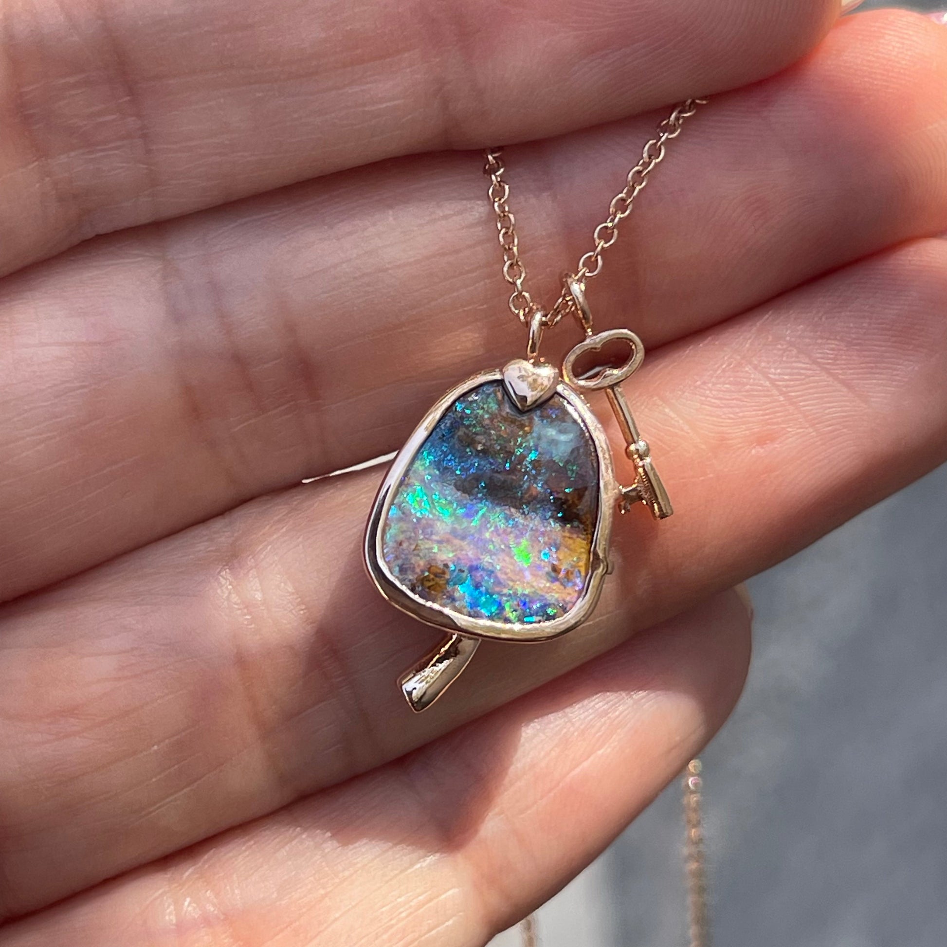 An Australian Opal Necklace by NIXIN Jewelry. A unique opal necklace with emeralds set in 14k rose gold.