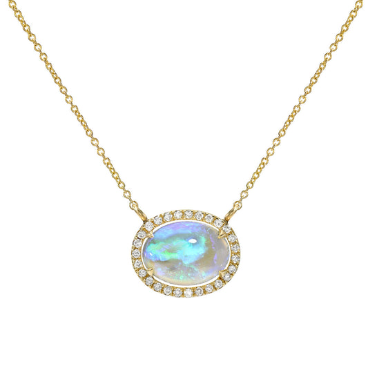 An Australian Opal Necklace by NIXIN Jewelry showcases a vibrant crystal opal pendant. The rare opal is securely set in 14K gold with brilliant pave diamonds, creating a truly unique jewelry piece.
