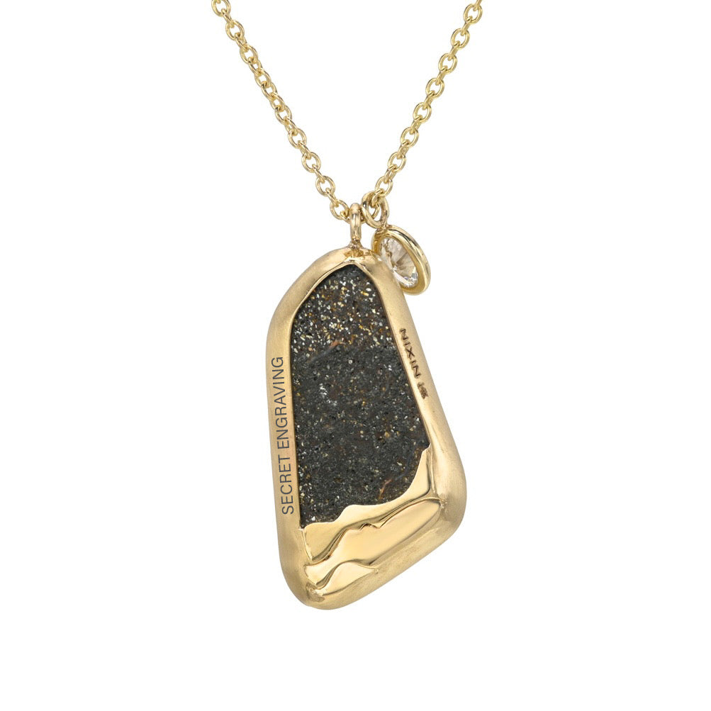 An Australian Opal Necklace by NIXIN Jewelry showing the reverse side of the boulder opal pendant and its intricate back setting. The gold mounting frames the natural ironstone matrix, with a polished wave design acting as jewelry art around the base. This unique fine jewelry view confirms the rare opal jewelry authenticity.