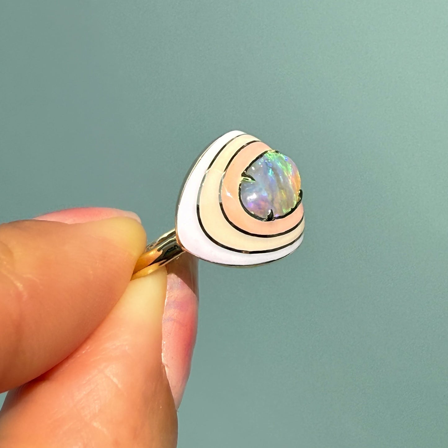 Side view of an Australian Opal Ring by NIXIN Jewelry, featuring a striking ombré design with enamel and an exquisite crystal opal. This unique opal jewelry piece is a stunning example of fine jewelry art and an eye-catching cocktail ring.