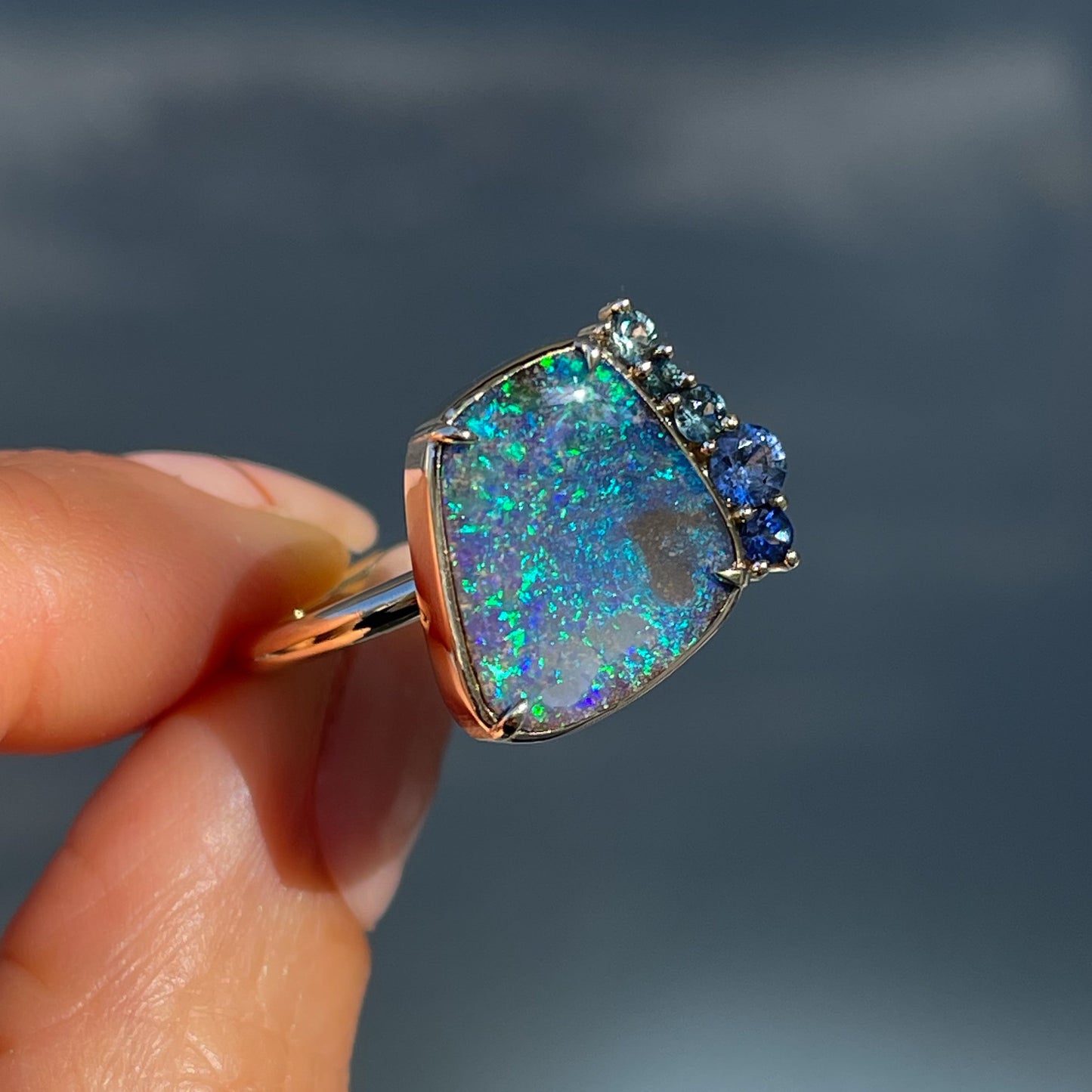 An Australian Opal Ring by NIXIN Jewelry. Luxury jewelry for lovers of Australian opals and sapphires.