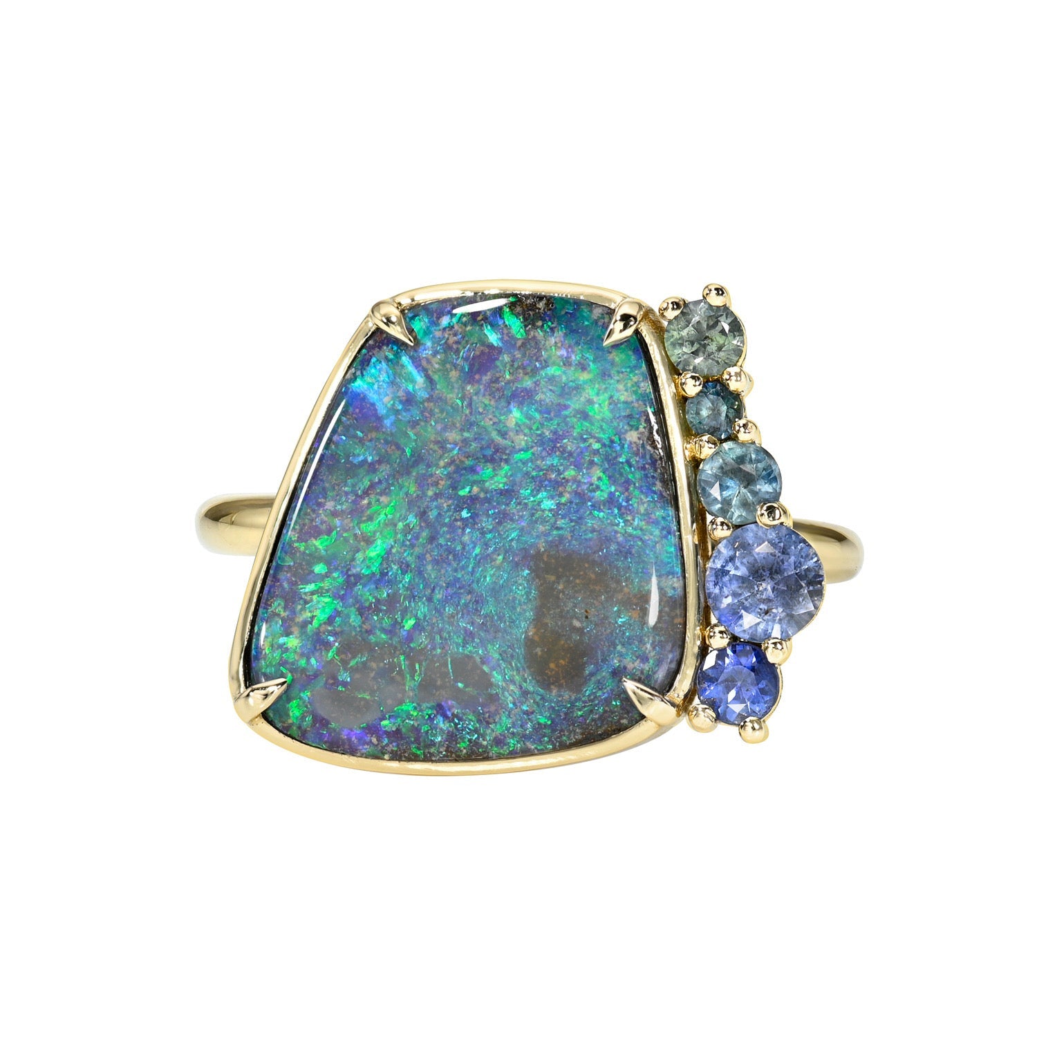 An Australian Opal Ring by NIXIN Jewelry. An opal and sapphire ring made in 14k gold.