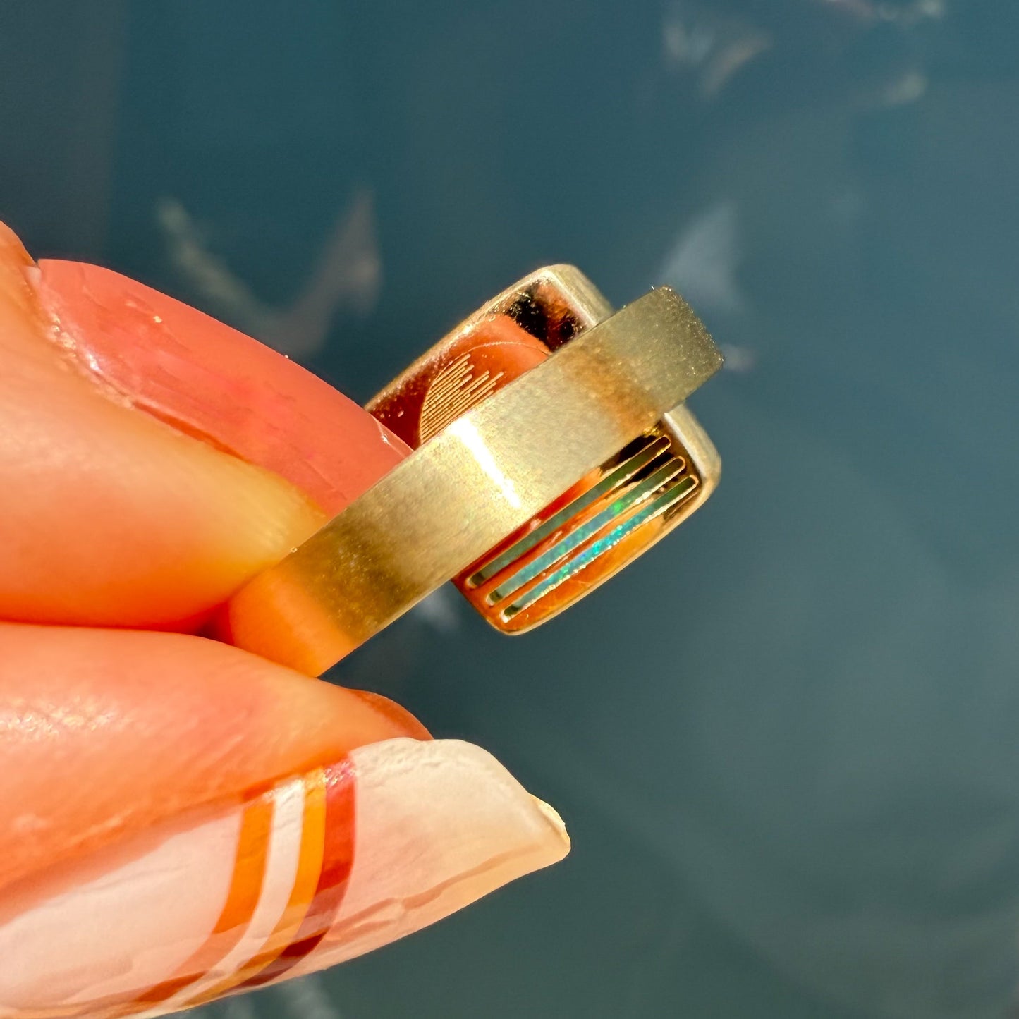 An Australian Opal Ring by NIXIN Jewelry, an investment in unique opal jewelry. This modern opal ring, with its vibrant natural opal, redefines luxury with a story engraved in back.