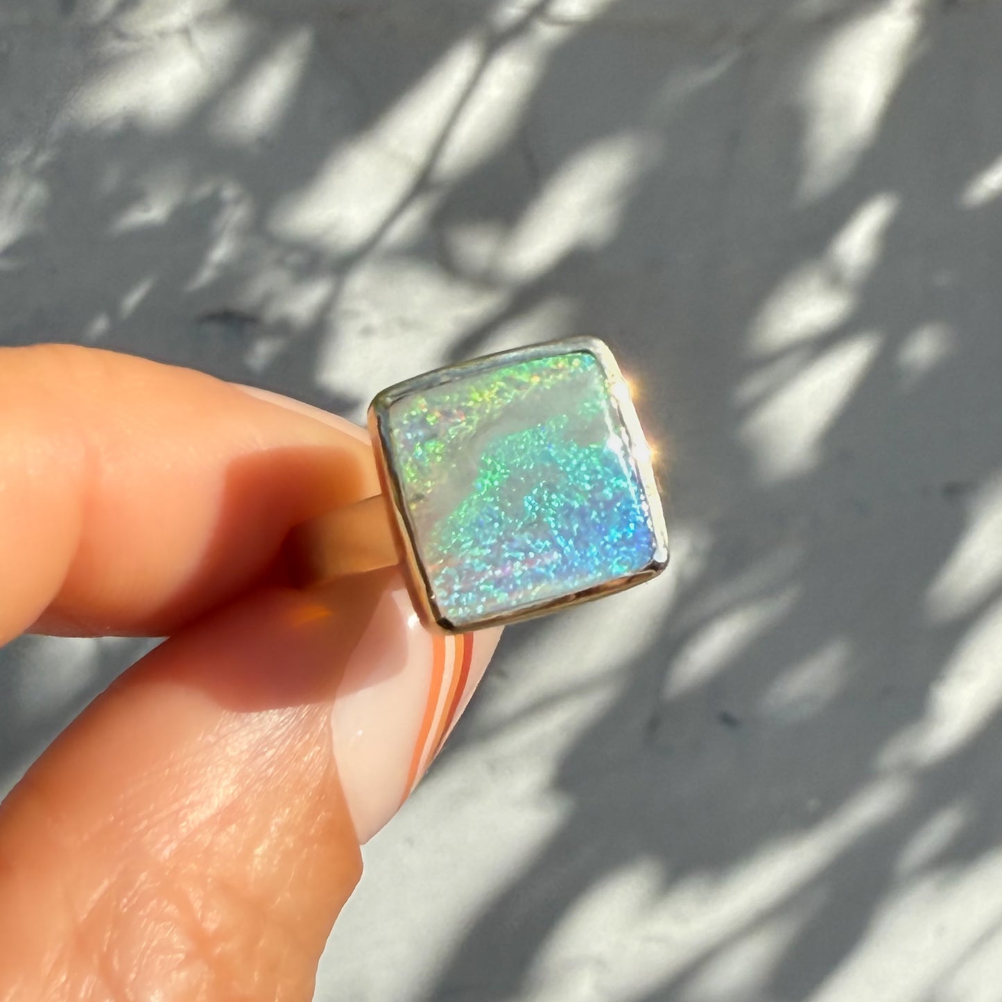 An Australian Opal Ring by NIXIN Jewelry, presenting a high-quality natural opal. This luxury ring embodies unique fine jewelry with its distinct modern opal ring style.