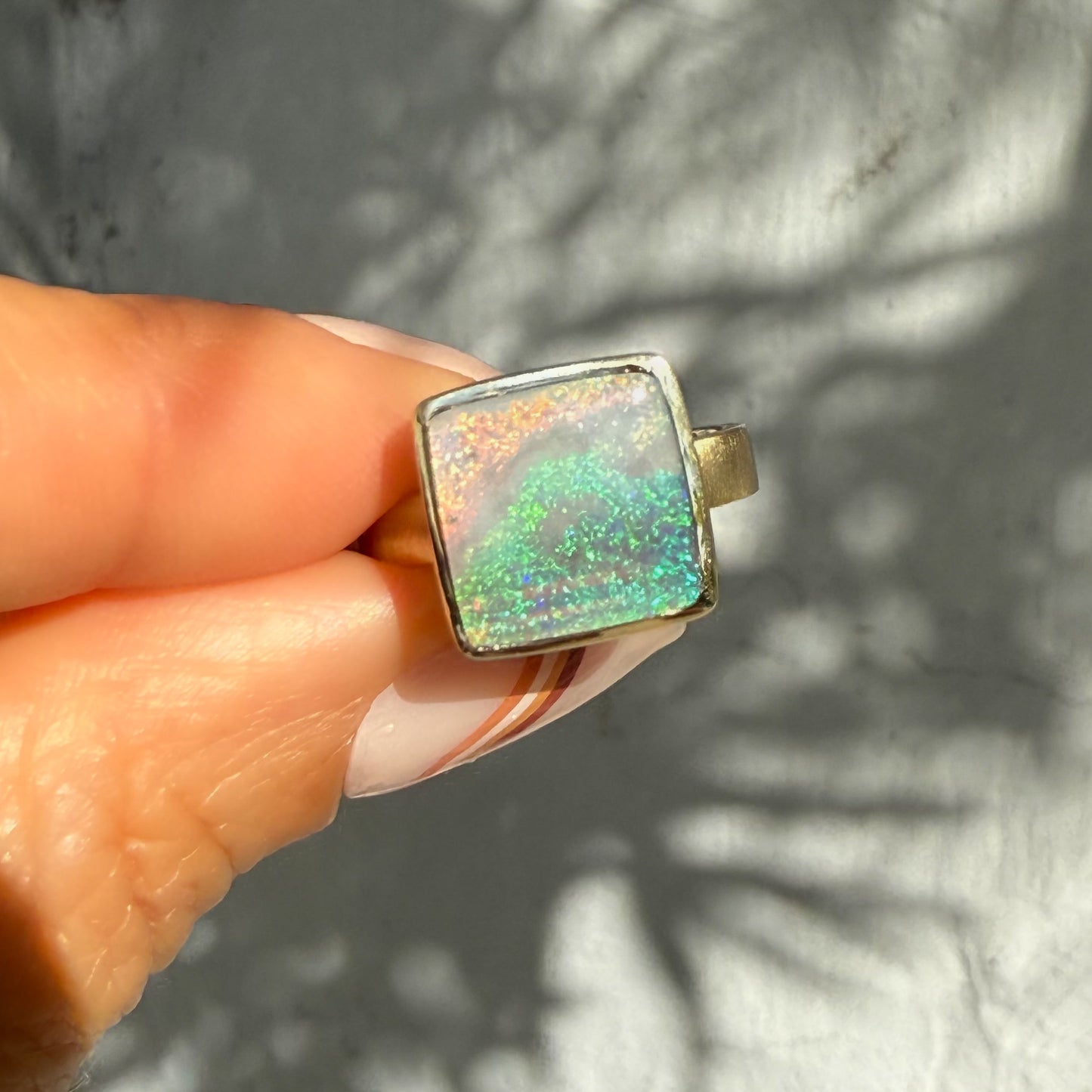 An Australian Opal Ring by NIXIN Jewelry, a true piece of jewelry art. Its unique design and precious australian opal make it a rare find in luxury jewelry.
