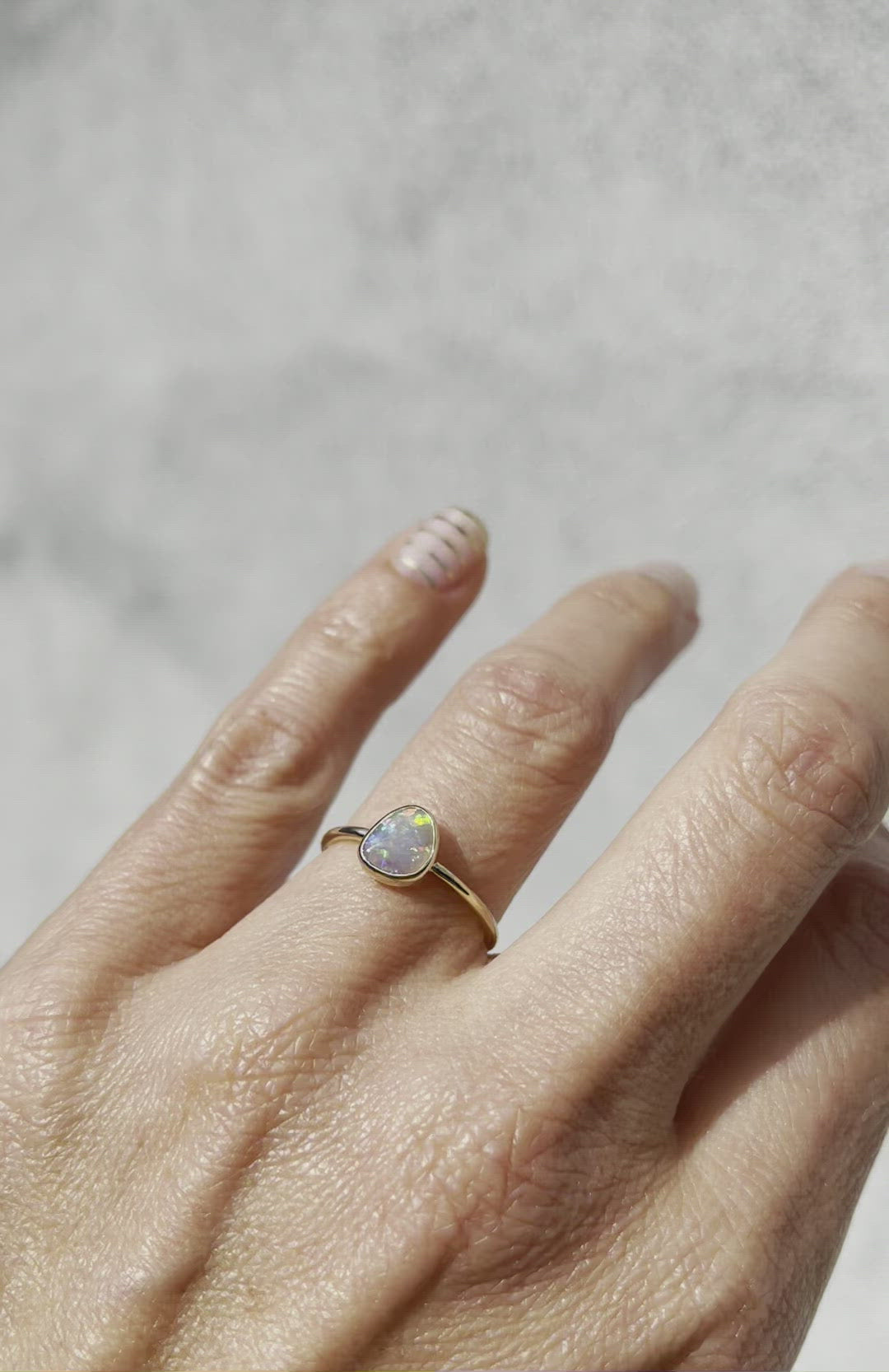 Video of rainbow opal ring by NIXIN Jewelry worn on hand