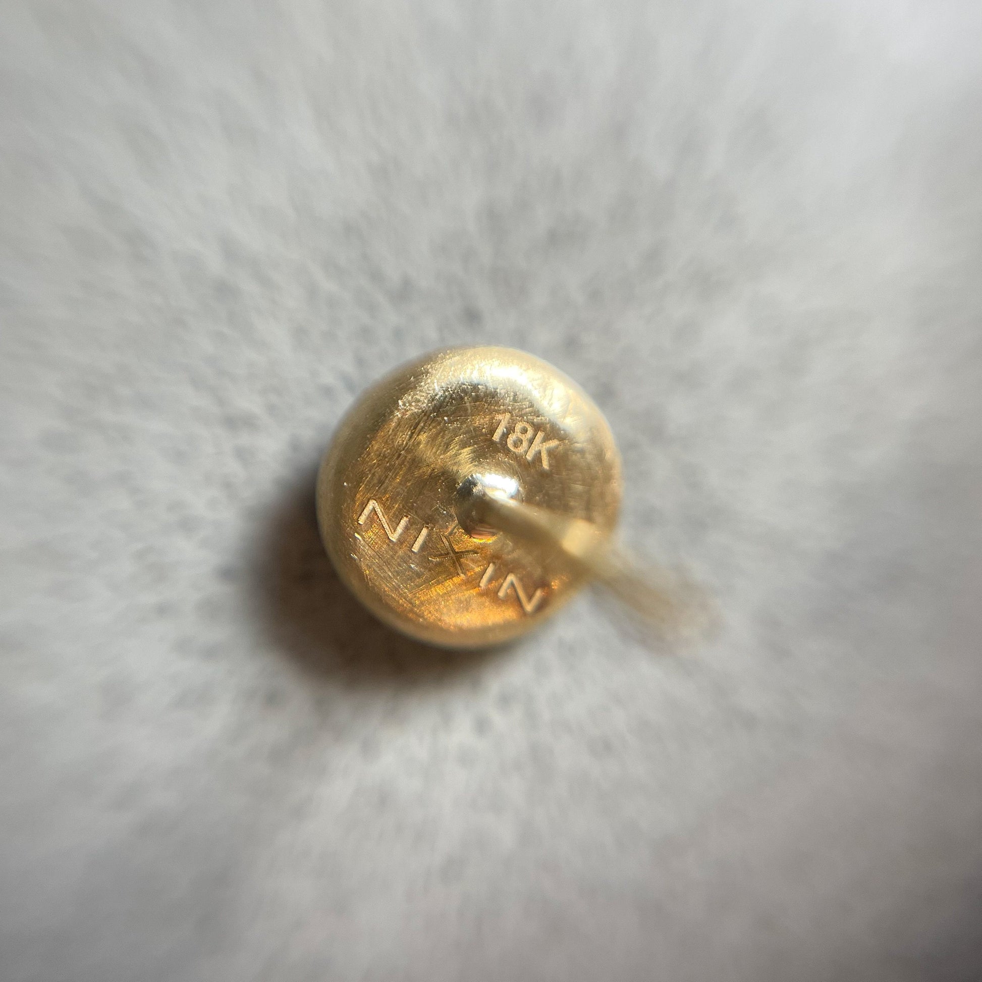 Back view of 18k gold earrings studs by NIXIN Jewelry