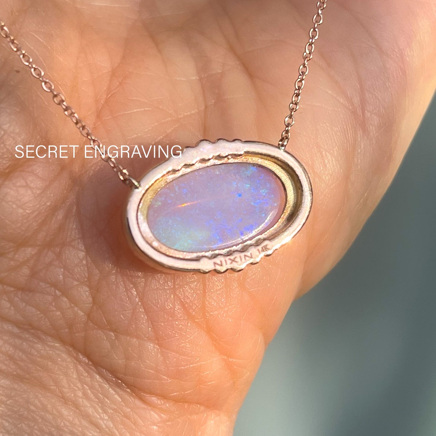The back of an Australian Opal Necklace by NIXIN Jewelry showing the location of the secret engraving.