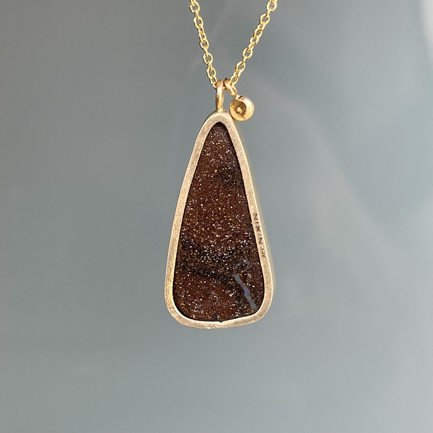 Back view of gold opal necklace by NIXIN Jewelry