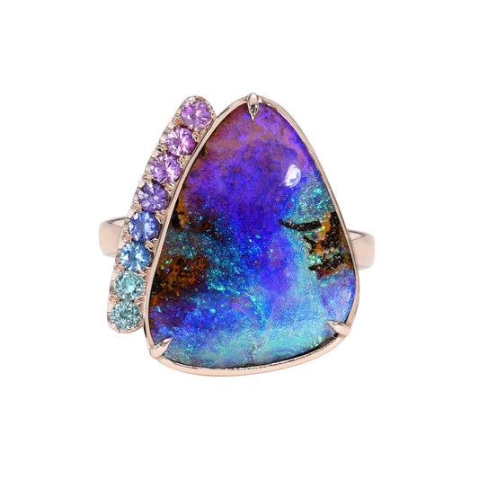 An Australian Opal Ring by NIXIN Jewelry features a pipe opal in 14k rose gold.