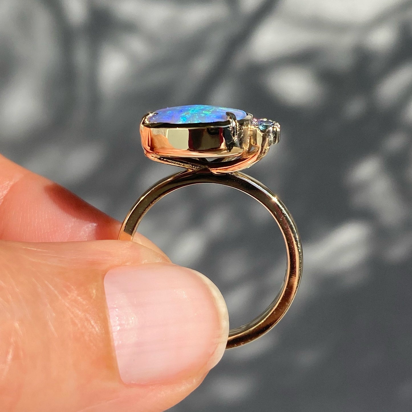 Side view of boulder opal and ombre sapphire ring by NIXIN Jewelry