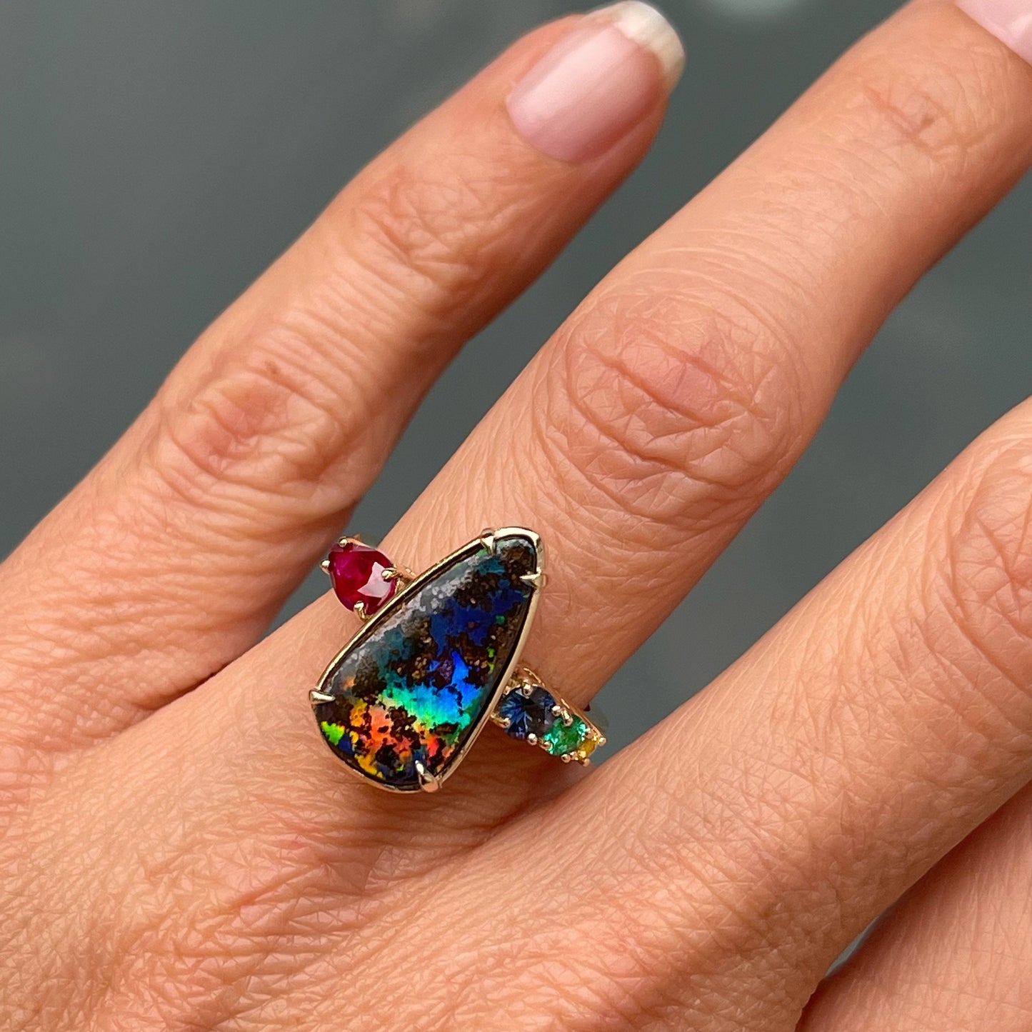 Gold opal ring modeled on hand by NINXIN Jewelry