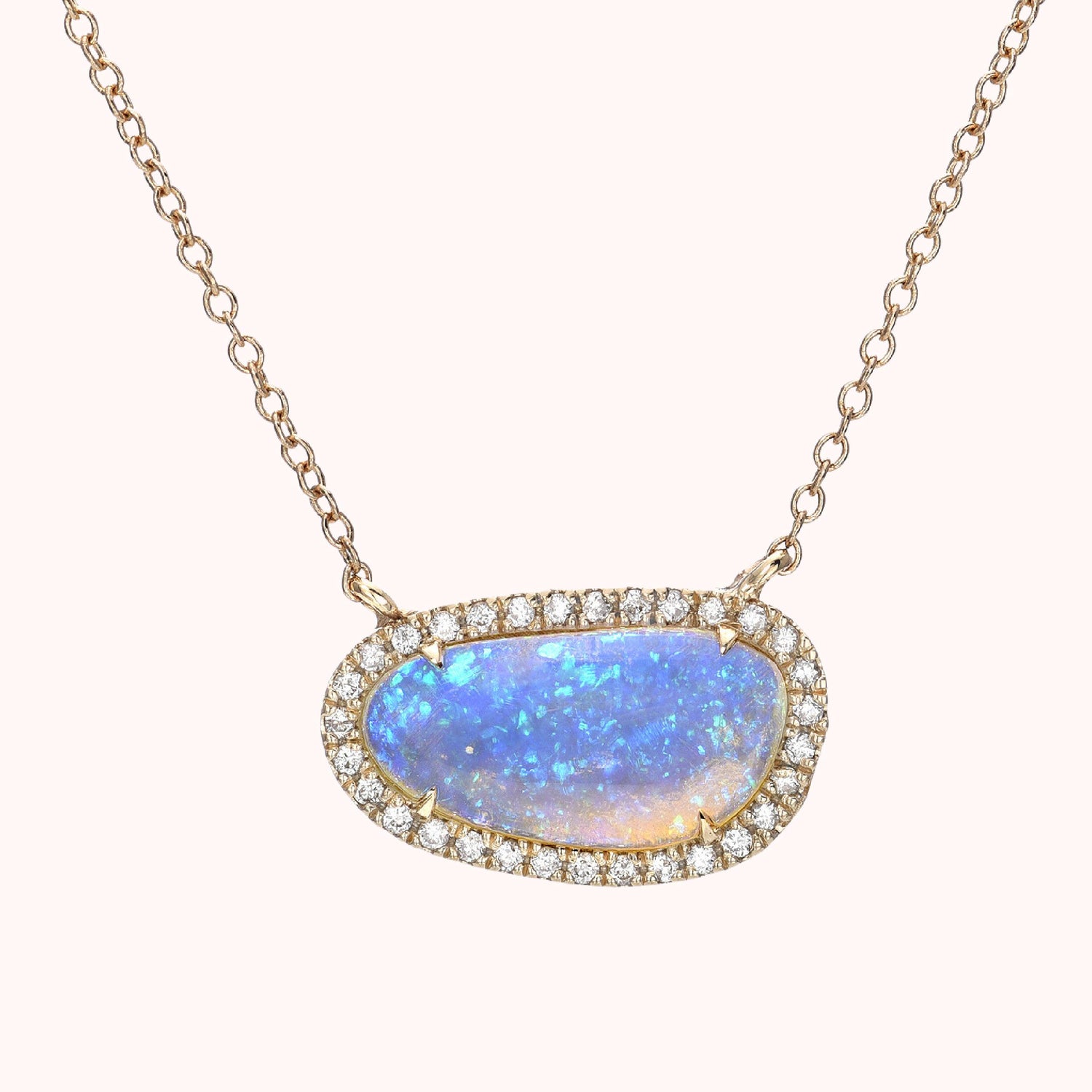 An Australian Opal Necklace by NIXIN Jewelry made in 14k gold with a Crystal Opal and pave diamond halo.