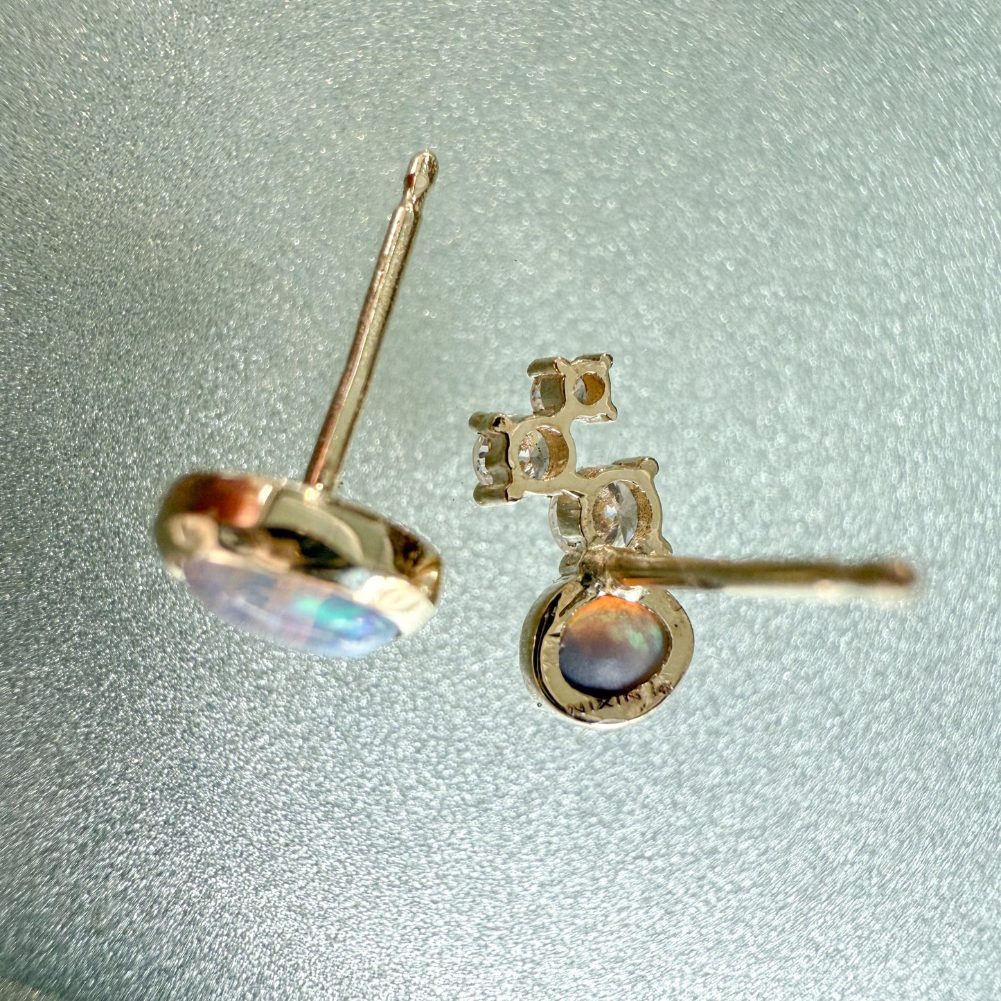 Australian Opal Earrings by NIXIN Jewelry. Back view of the 14k gold opal studs, showing the secure construction and the NIXIN maker's mark. These black opal jewelry pieces offer exceptional quality in australian opal jewelry.
