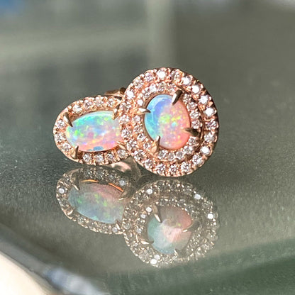 A pair of Australian Opal Earrings by NIXIN Jewelry. Rose gold opal stud earrings. 