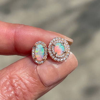 A pair of Australian Opal Earrings by NIXIN Jewelry in rose gold with pave diamonds.