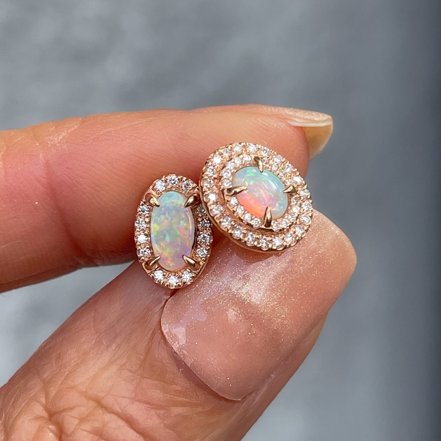 A pair of Australian Opal Earrings by NIXIN Jewelry in 14k rose gold with prong setting.