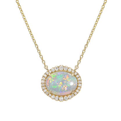 An Australian Opal Necklace by NIXIN Jewelry, featuring a captivating Lightning Ridge crystal opal. This luxury necklace boasts a brilliant diamond halo, perfectly suited for those seeking unique fine jewelry. An elegant opal necklace for women who appreciate rare opal jewelry.
