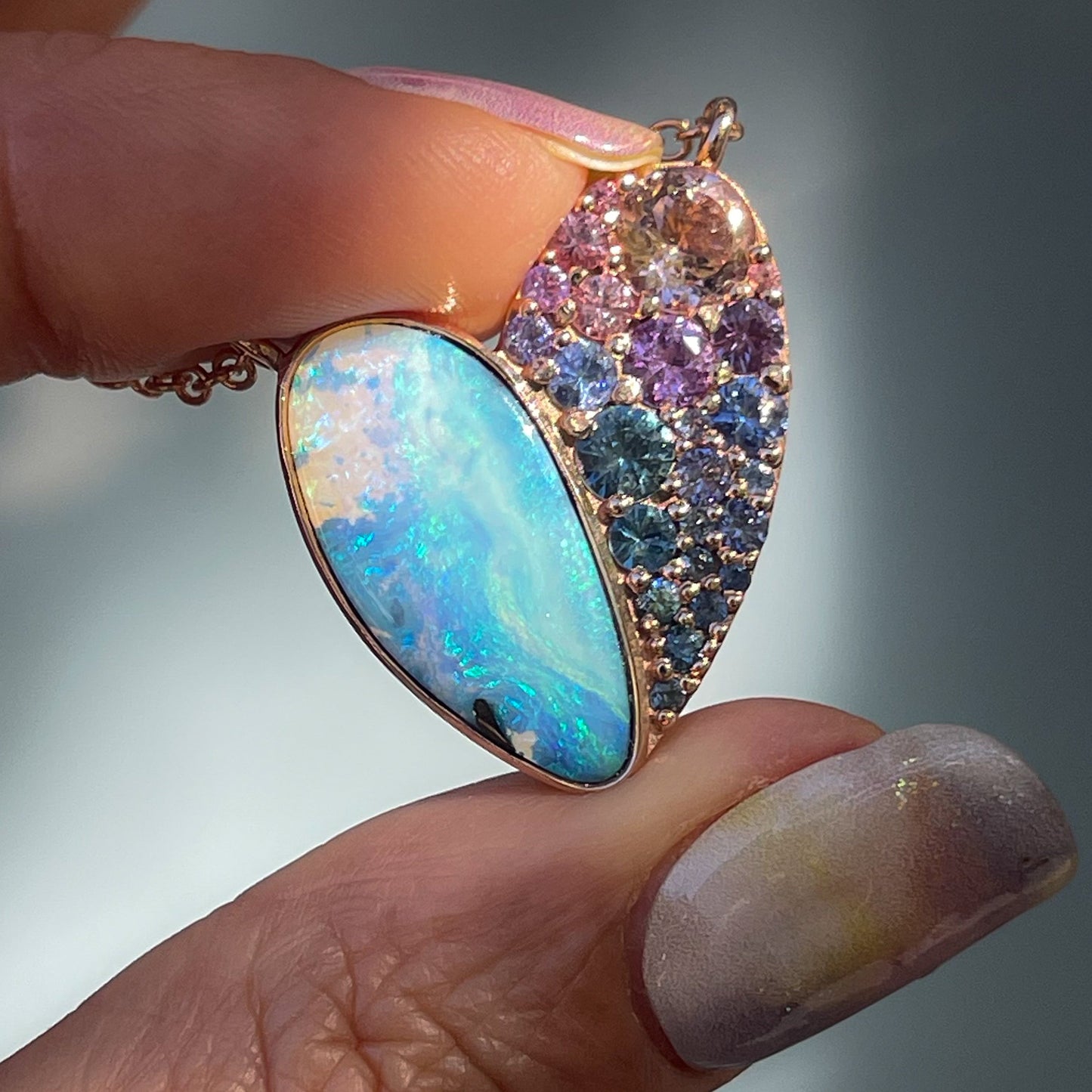 A Heart Opal Necklace by NIXIN Jewelry with a boulder opal and pave gemstones.