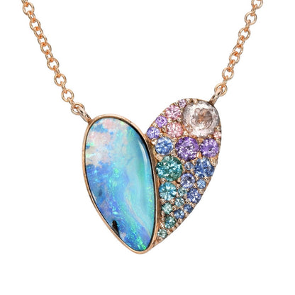 A Heart Opal Necklace by NIXIN Jewelry made with an Australian Opal and sapphires set in rose gold.