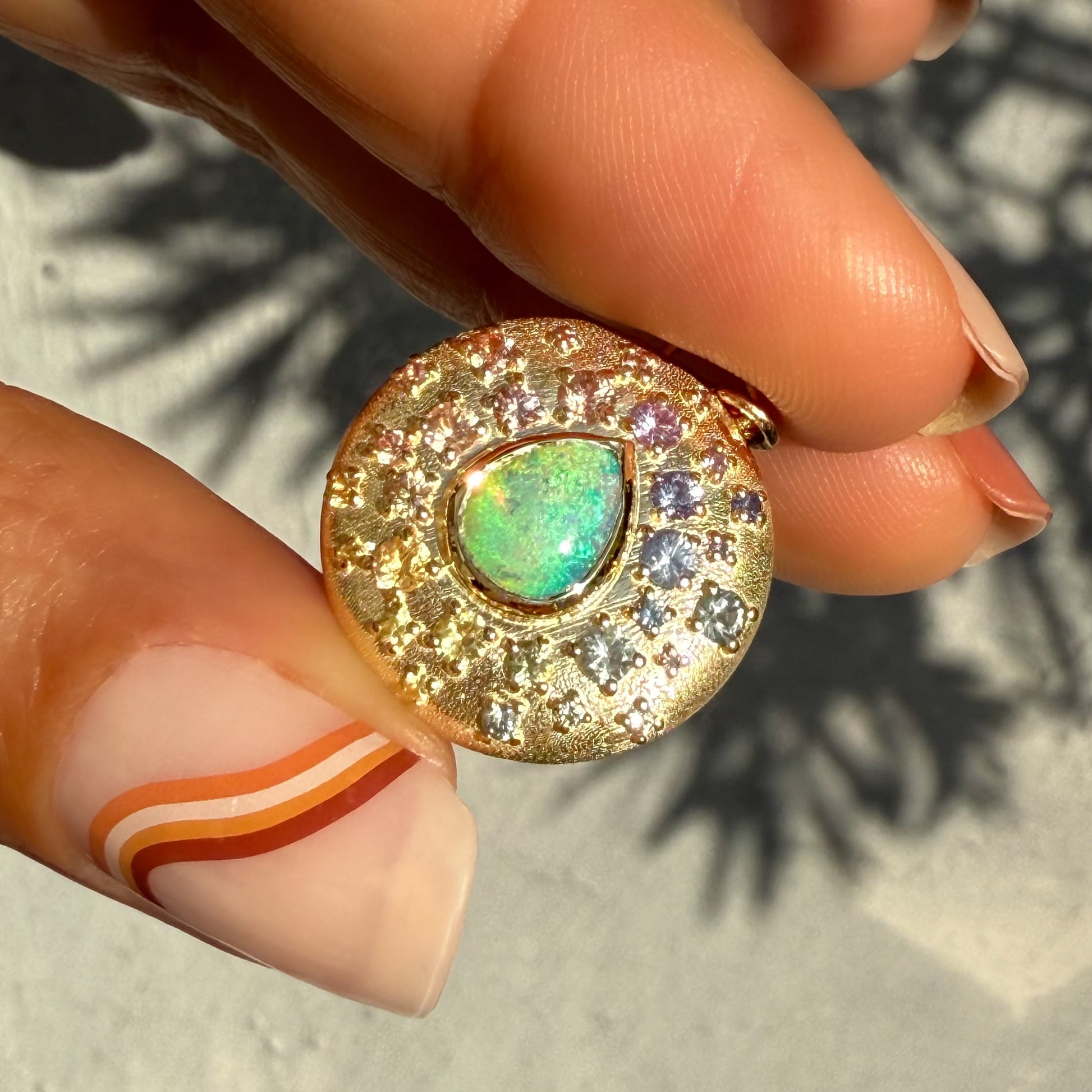 An Australian Opal Necklace by NIXIN Jewelry embodies exquisite jewelry art. This unique fine jewelry presents a pear-shaped opal stone with a captivating play-of-color.