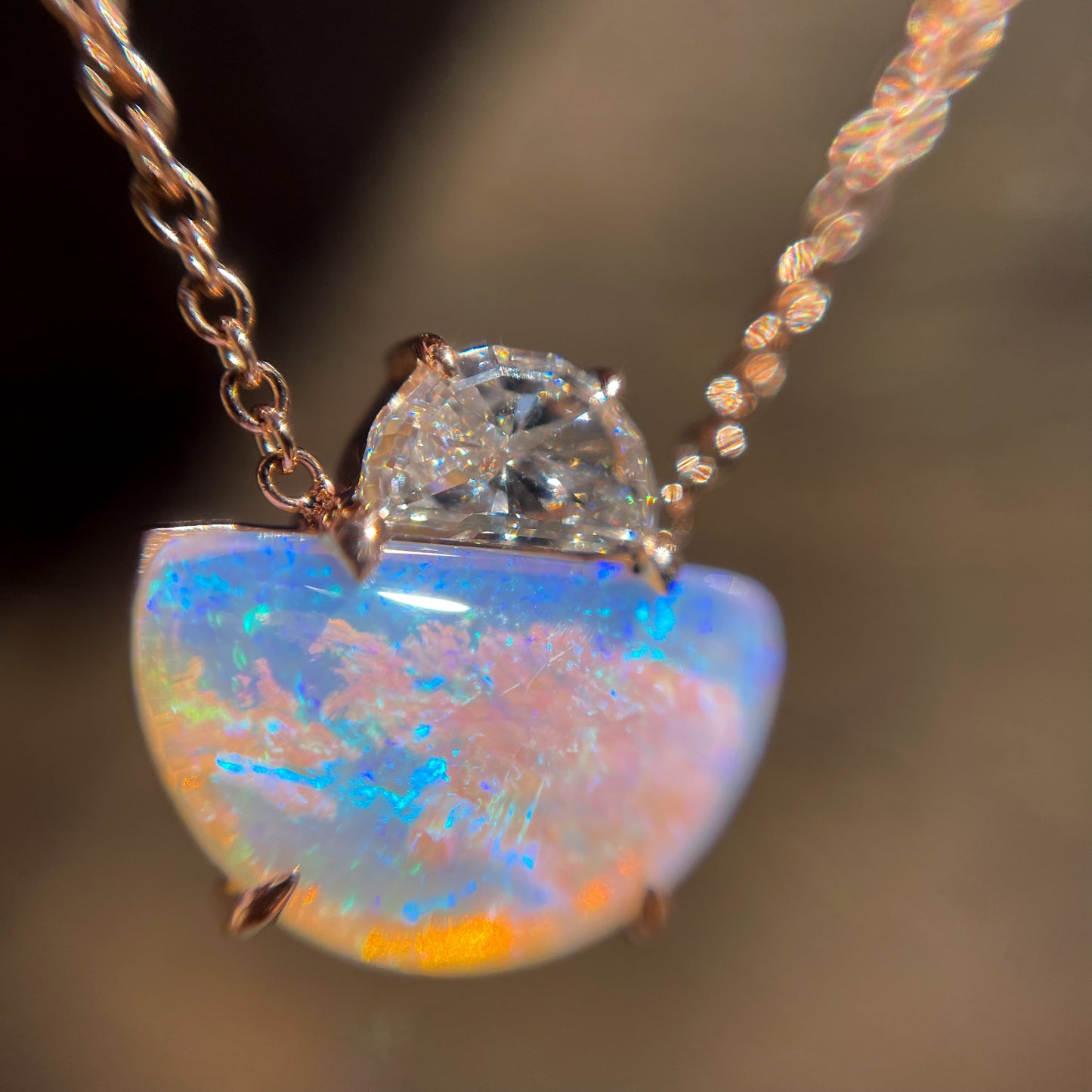 Close up of an Australian Opal Necklace by NIXIN Jewelry. A unique opal necklace with a diamond.