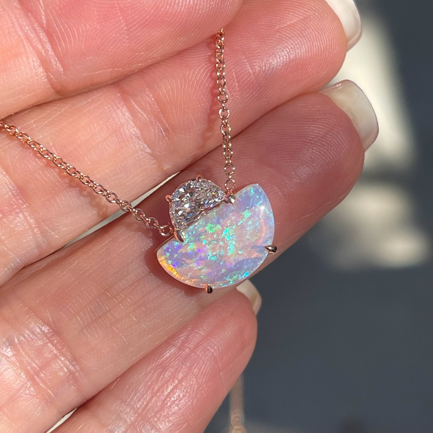 An Australian Opal Necklace by NIXIN Jewelry. A half moon diamond with a crystal boulder opal.