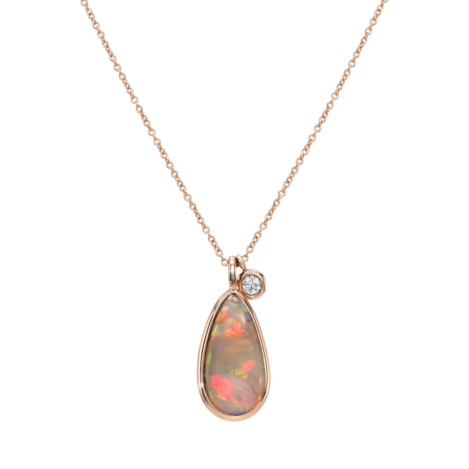 An Australian Opal Necklace by NIXIN Jewelry with a dark opal and a diamond charm.