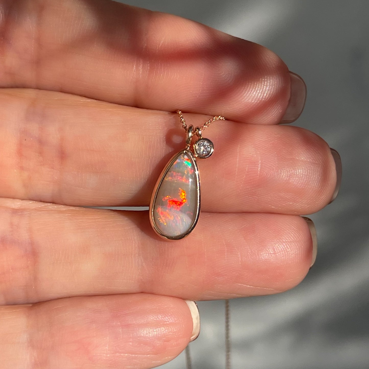 An Australian Opal Necklace by NIXIN Jewelry. A dark opal necklace with red fire.