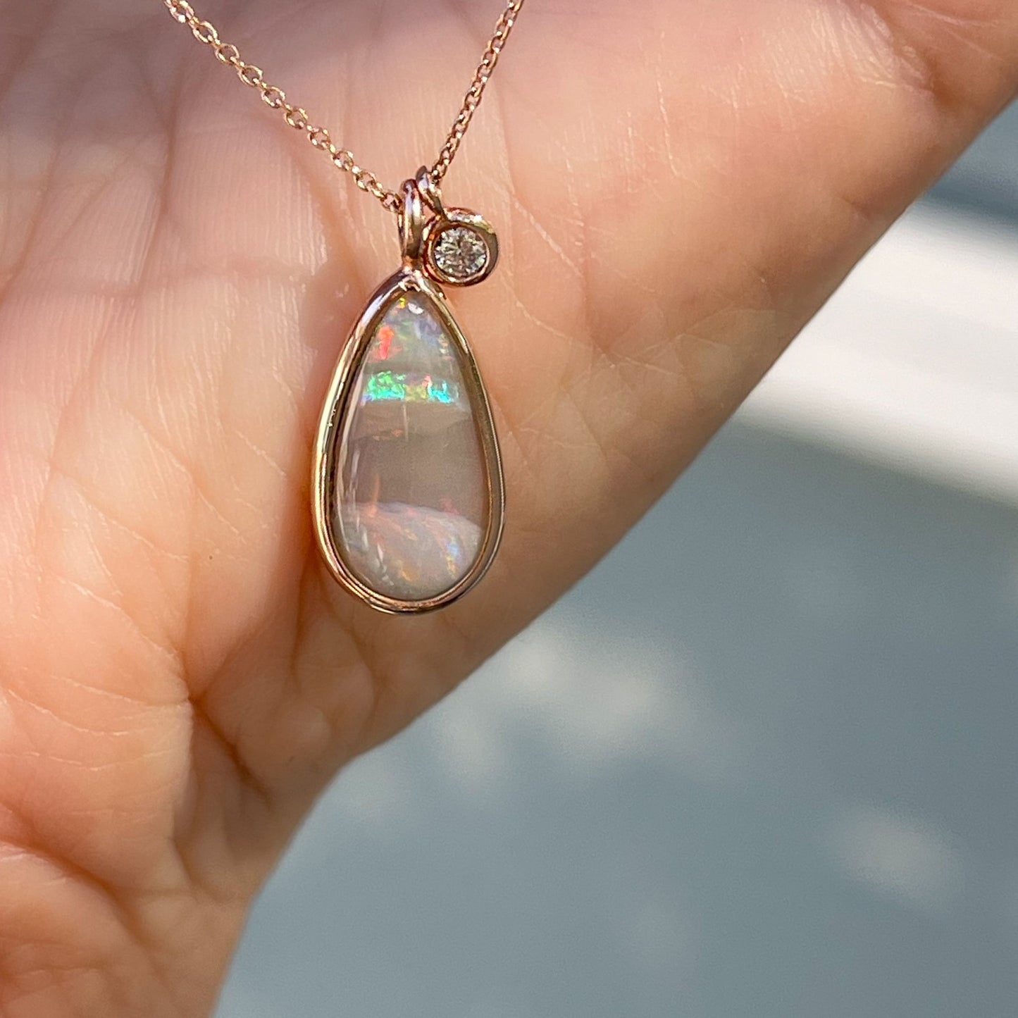 An Australian Opal Necklace by NIXIN Jewelry. A unique opal necklace with a diamond charm.