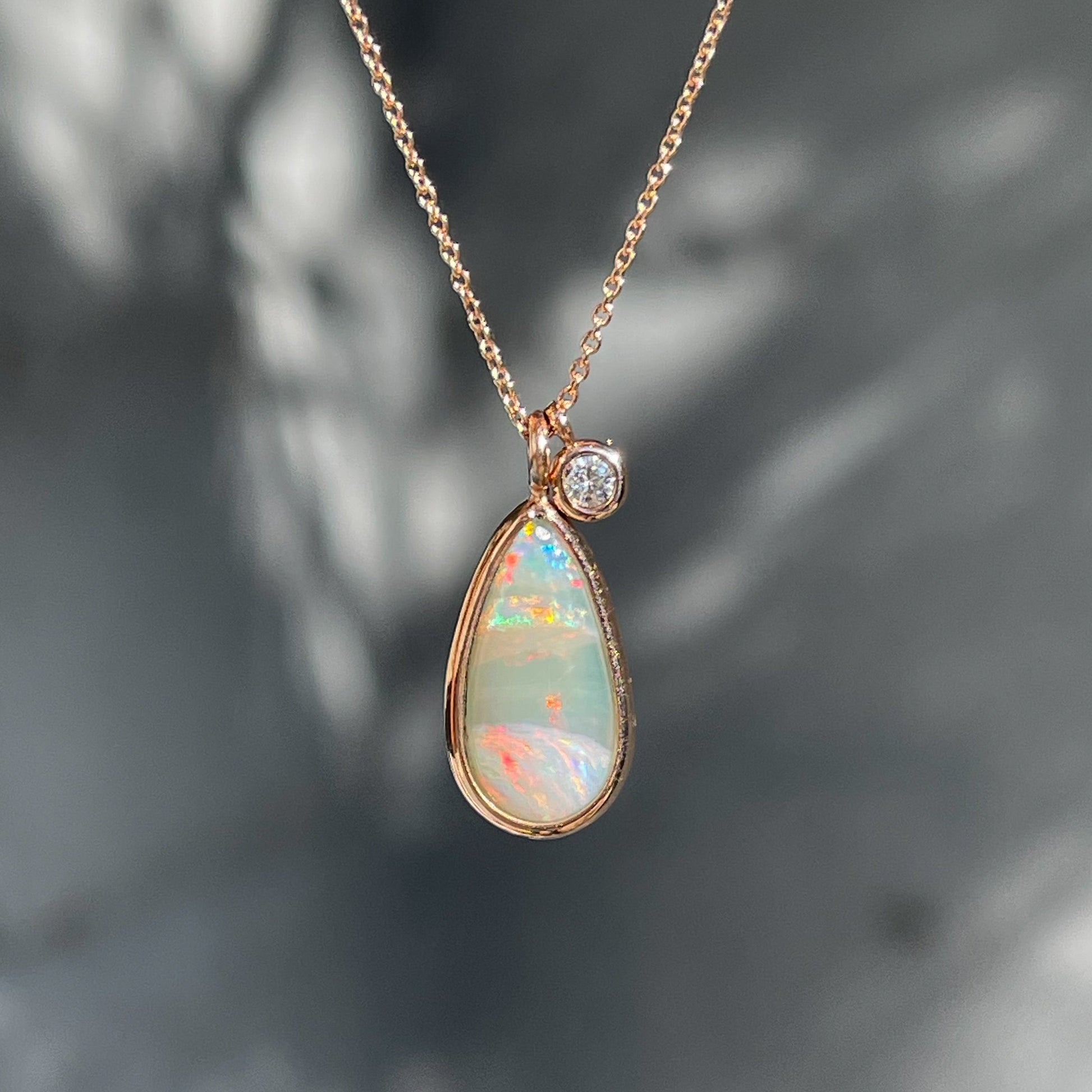 An Australian Opal Necklace by NIXIN Jewelry. An opal and diamond necklace set in rose gold.