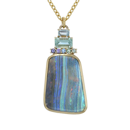 An Australian Opal Necklace by NIXIN Jewelry against white backdrop. Opal jewelry for sale.