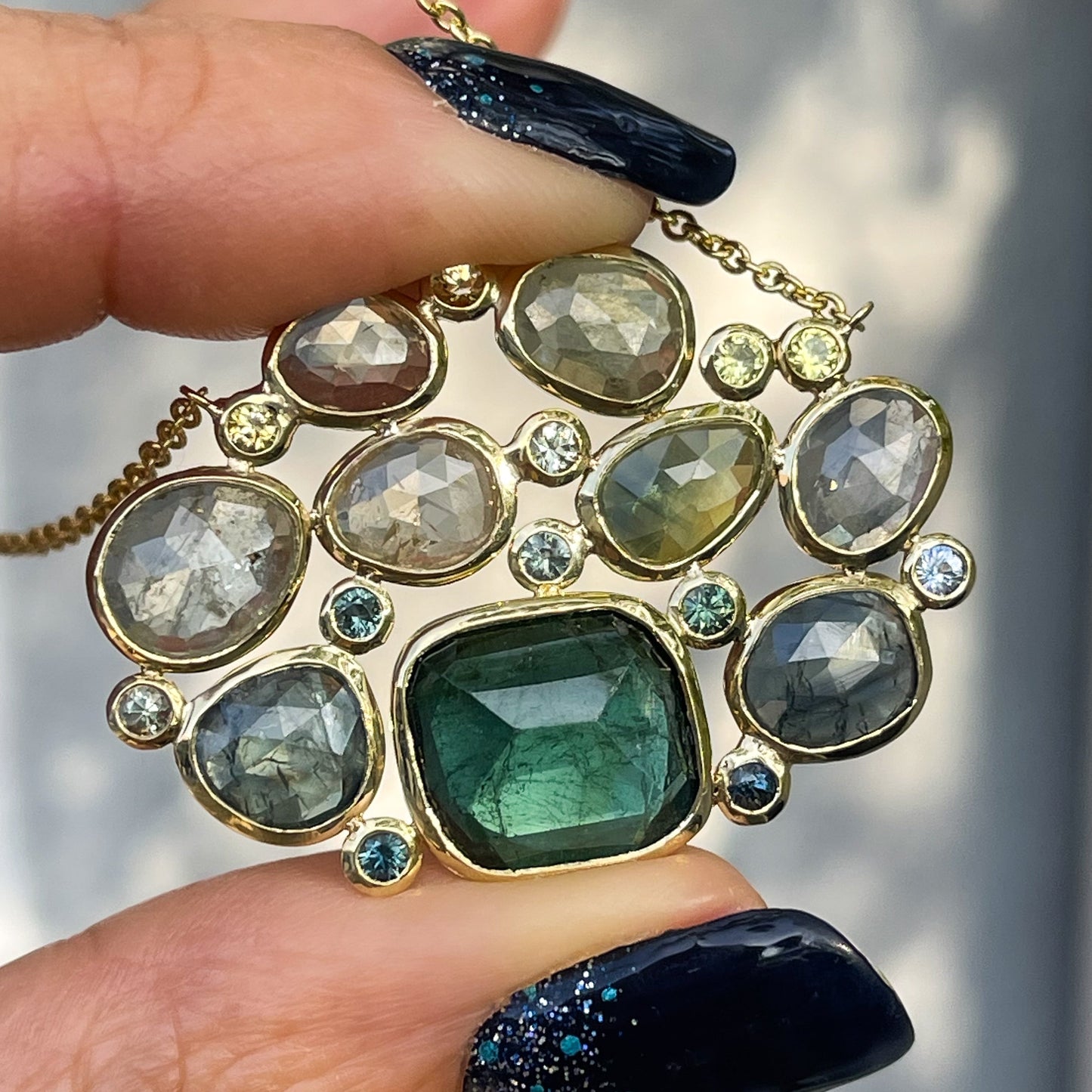  A Tourmaline and Sapphire Necklace by NIXIN Jewelry with green sapphires and a teal tourmaline.