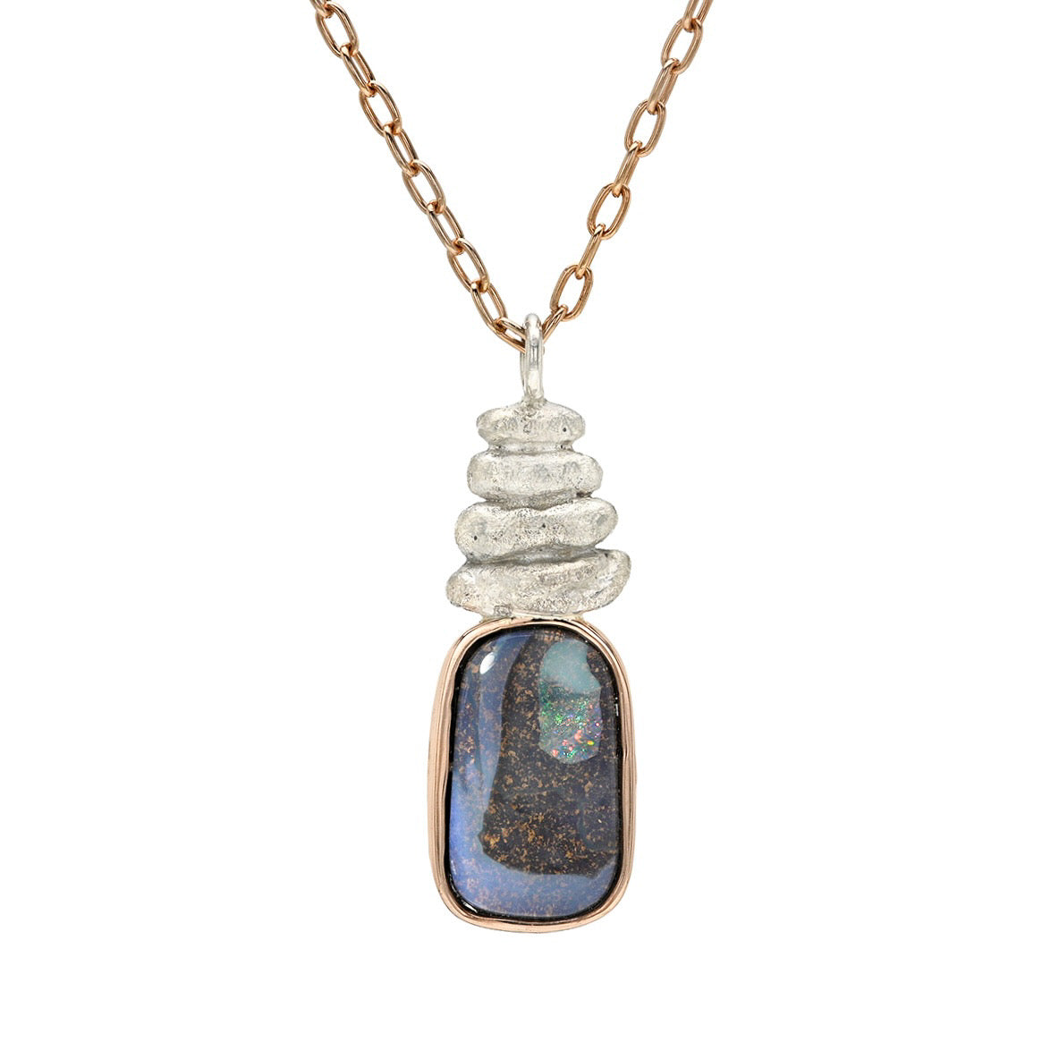 A clean studio portrait of an Australian Opal Necklace by NIXIN Jewelry presents the piece against a crisp background for a clear view of its proportions. The luxury necklace features a high-quality boulder opal that serves as a stunning opal pendant necklace. Unique fine jewelry inspired by the opal stone is a hallmark of the NIXIN Jewelry collection.