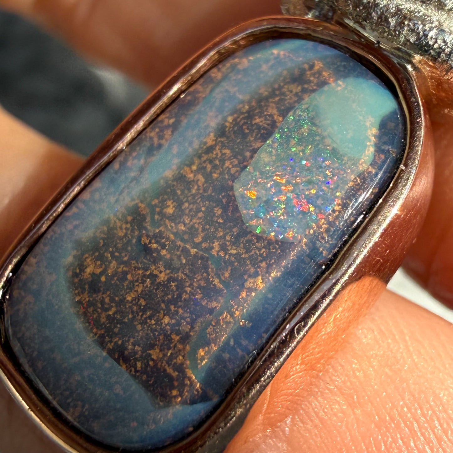 Focused entirely on the gemstone, this is an Australian Opal Necklace by NIXIN Jewelry highlighting the brilliant "Low Tide" color bar. This unique opal jewelry exhibits a rare spectrum of light, making the opal stone the focal point of the design. It is a picture stone masterpiece of jewelry art designed for those who value rare opal jewelry.