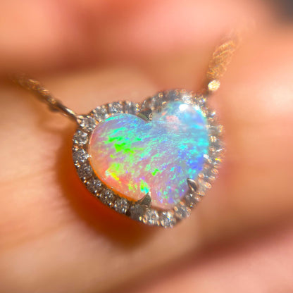 A magnified shot of an Opal Heart Necklace by NIXIN Jewelry. The Australian opal necklace is available with other opal jewelry for sale on NIXINjewelry.com.