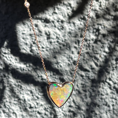 An Australian Opal Necklace by NIXIN Jewelry with a diamond in the chain.