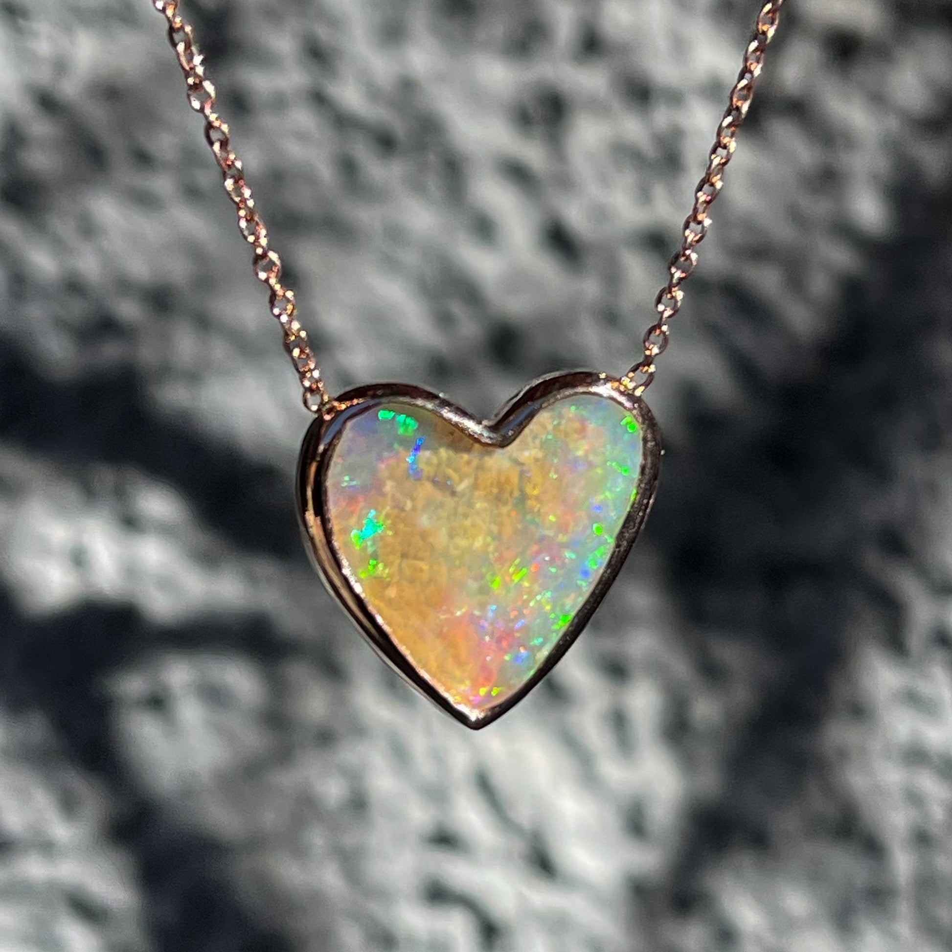 An Australian Opal Necklace by NIXIN Jewelry with a crystal opal in a bezel setting.
