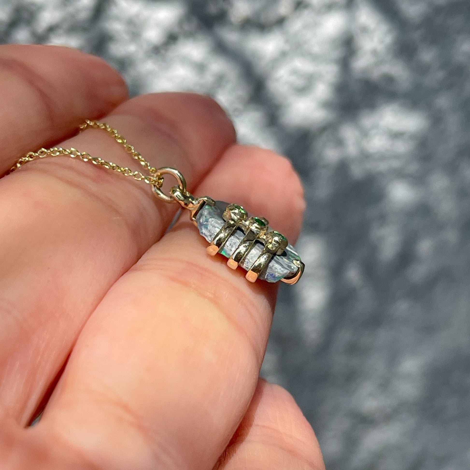 Side view of an Australian Opal Necklace by NIXIN Jewelry. The unique opal necklace is one of a kind.