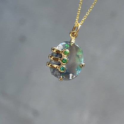 An Australian Opal Necklace by NIXIN Jewelry with a rough opal in a gold mounting. 