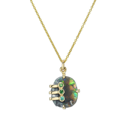 An Australian Opal Necklace by NIXIN Jewelry with a Black Opal set in yellow gold.