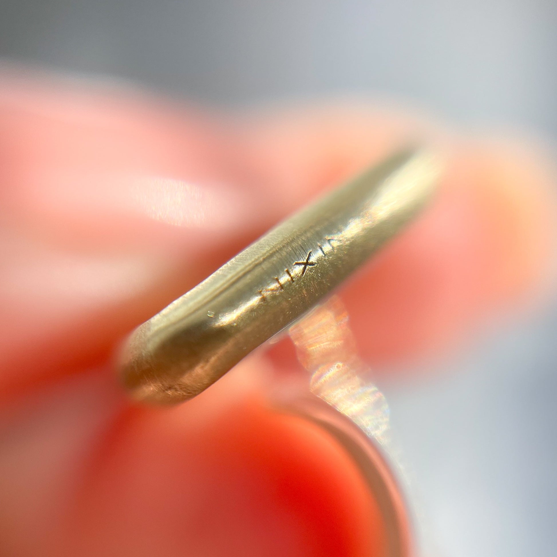 Close up of the gold bezel setting on an Australian Opal Necklace by NIXIN Jewelry.