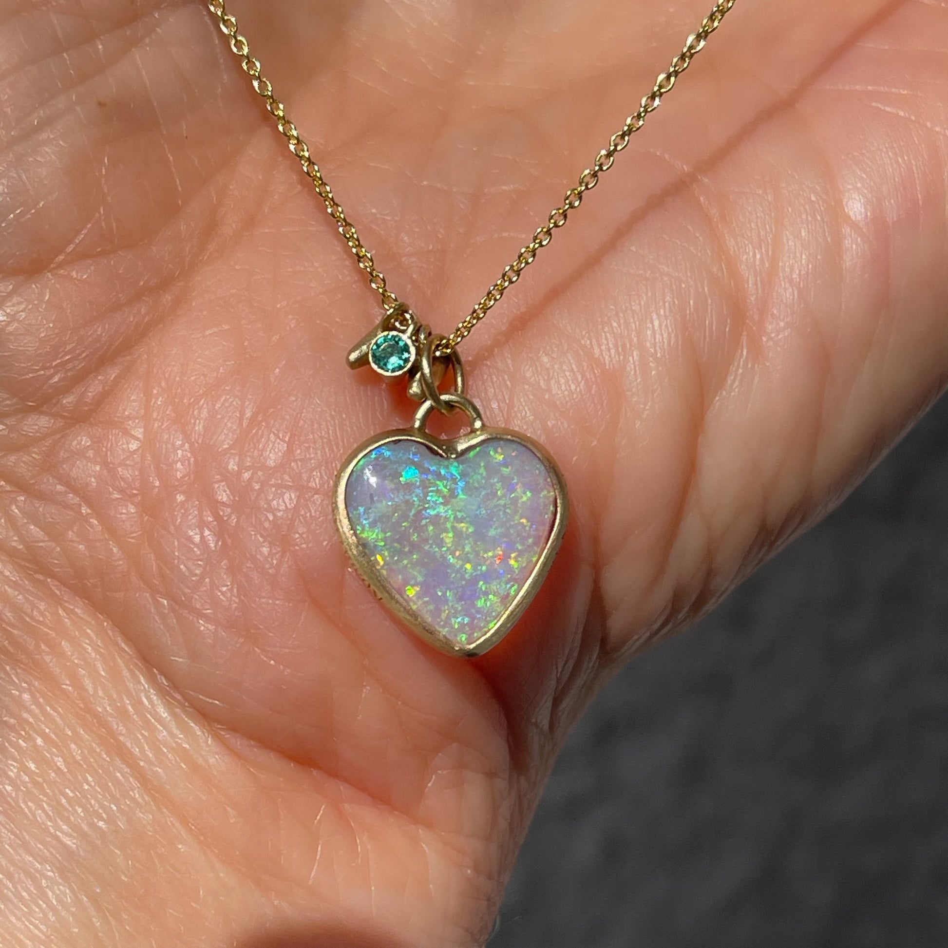 An Australian Opal Necklace by NIXIN Jewelry with a lightning ridge opal set in 14k gold.