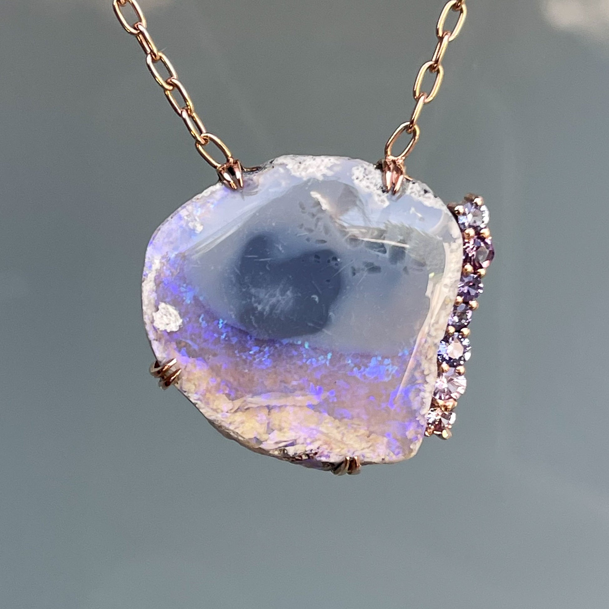 An Australian Opal Necklace by NIXIN Jewelry. A purple opal from Lightning Ridge set in claw prongs.