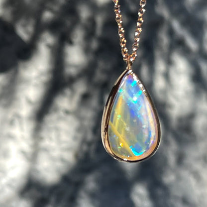 Close up of an Australian Opal Necklace by NIXIN Jewelry showing a blue flash pattern in the Australian Opal.